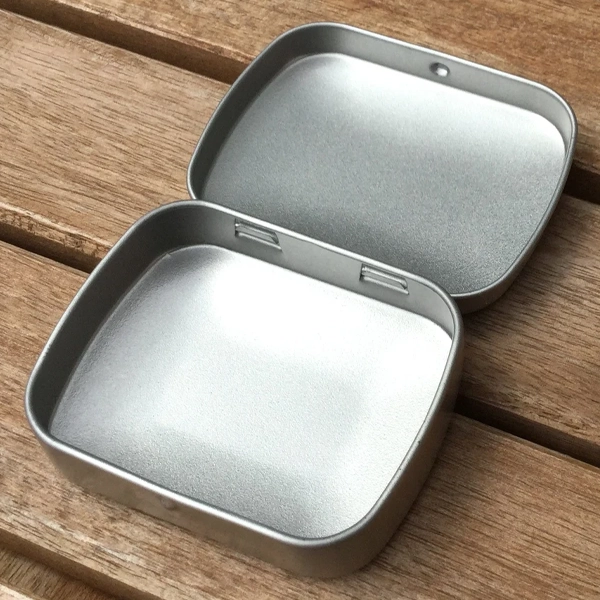 small hinged tin box